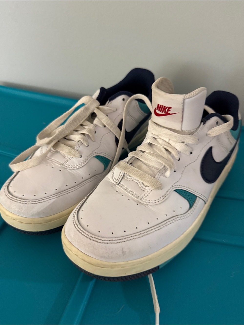 Nike White Low-Top Sneakers with Teal Accents and Navy Swoosh
